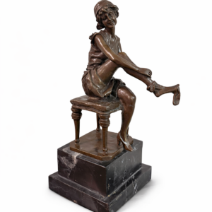 Bronze sculpture of female putting on stockings by Gori
